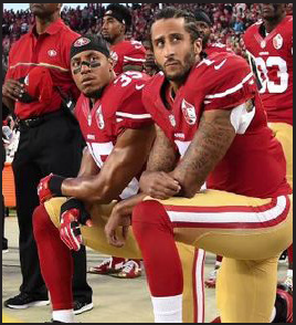 Kaepernick and team member kneel on sideline during the National Anthem.