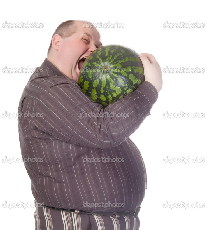 Obese man with a huge belly attempting to bite into a watermelon as his insatiable appetite gets the better of him before he can cut it.