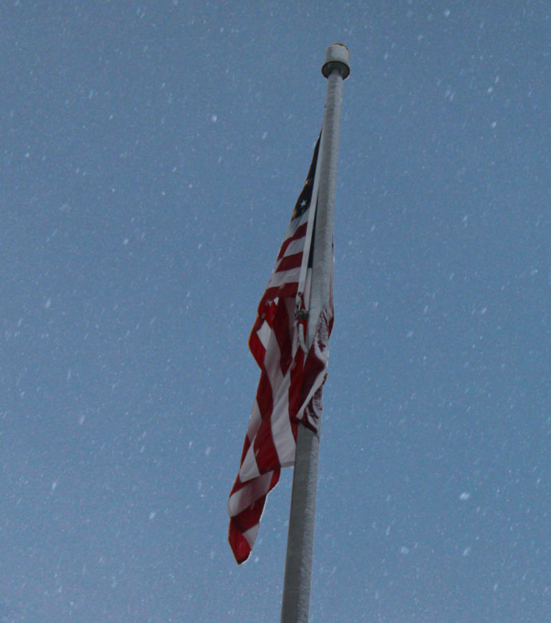 American flag in the snow.