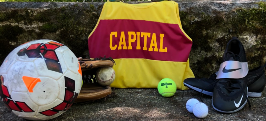 All spring sports equipment is placed in the center surrounding a Capital High School jersey. The camera angle is straight forward.
