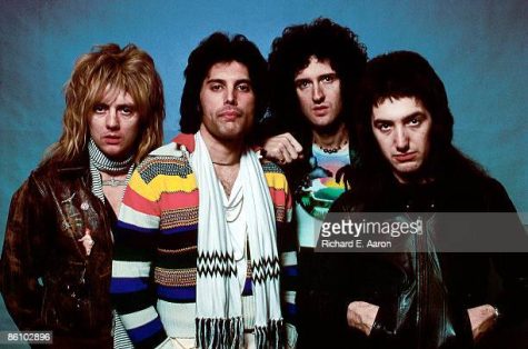 Shown are the four members of Queen, Roger Taylor, Freddie Mercury, Brian May, and John Deacon (Left to Right)